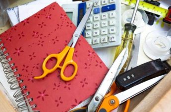 Cluttered drawer with everyday items