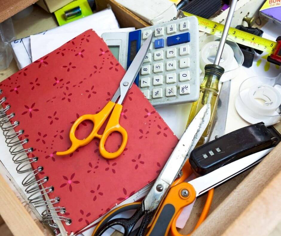 Cluttered drawer with everyday items