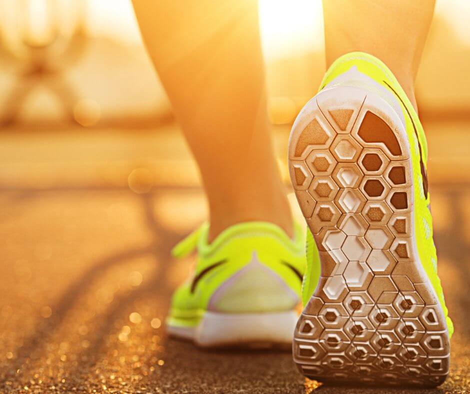 ladies legs in running shoes