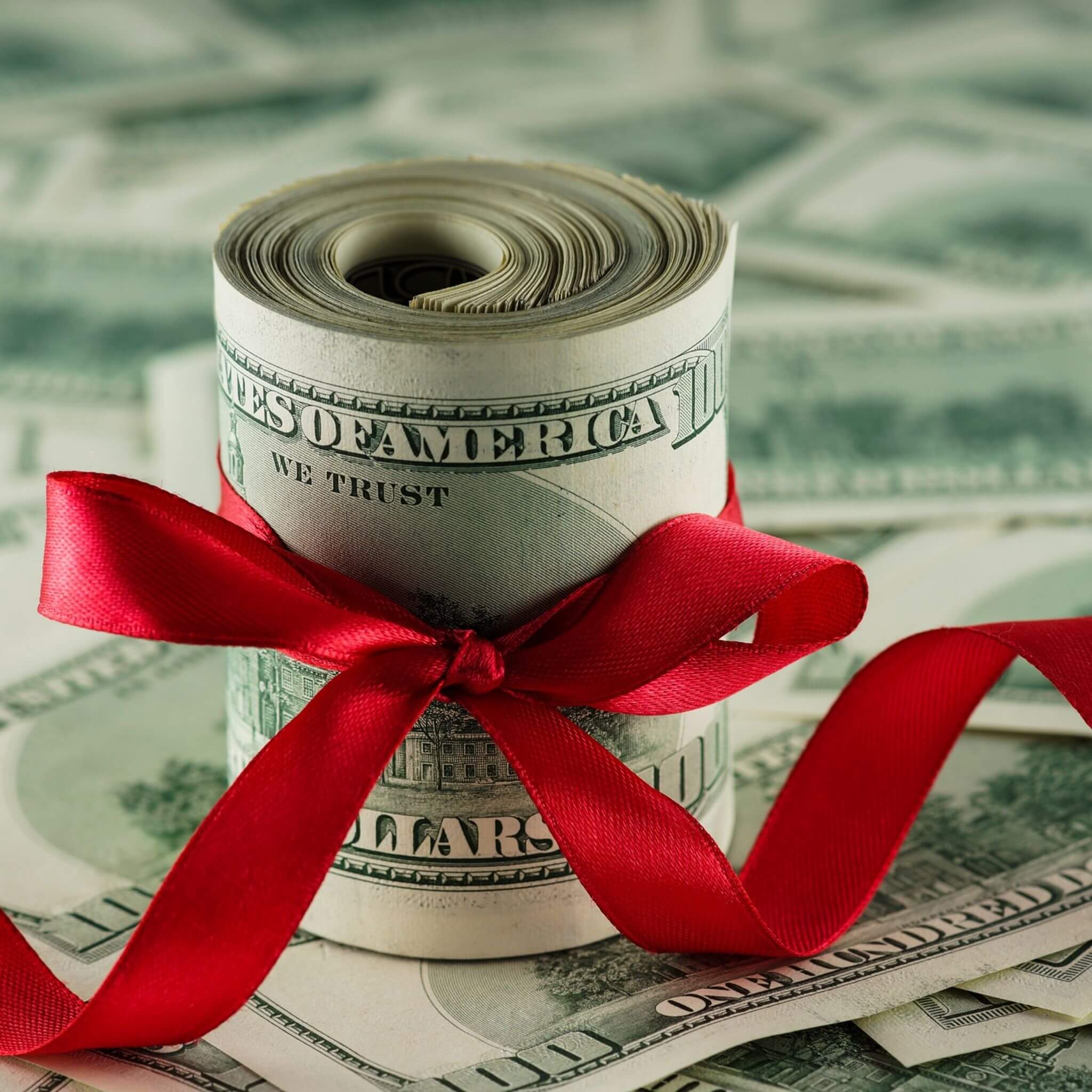 Dollars with a red bow