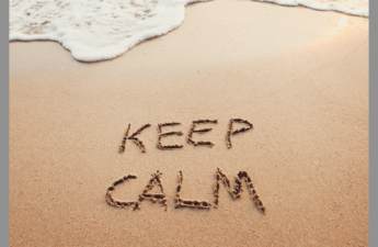 Keep Calm written in the sand