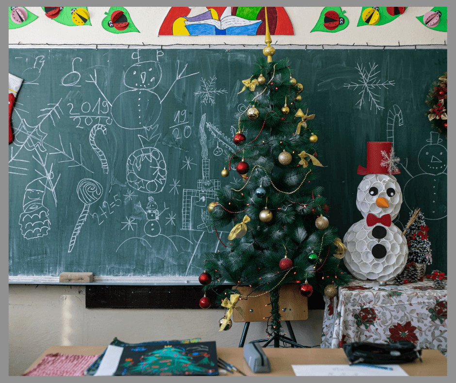 A Christmas Tree and Snowman setting on a teacher's desk.