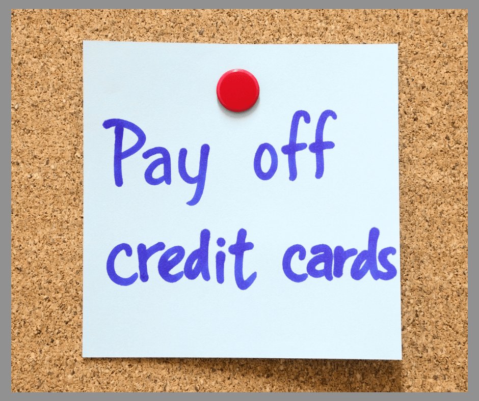 A Post-it with a reminder to pay off credit cards