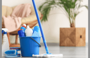 A blue bucket of cleaning supplies