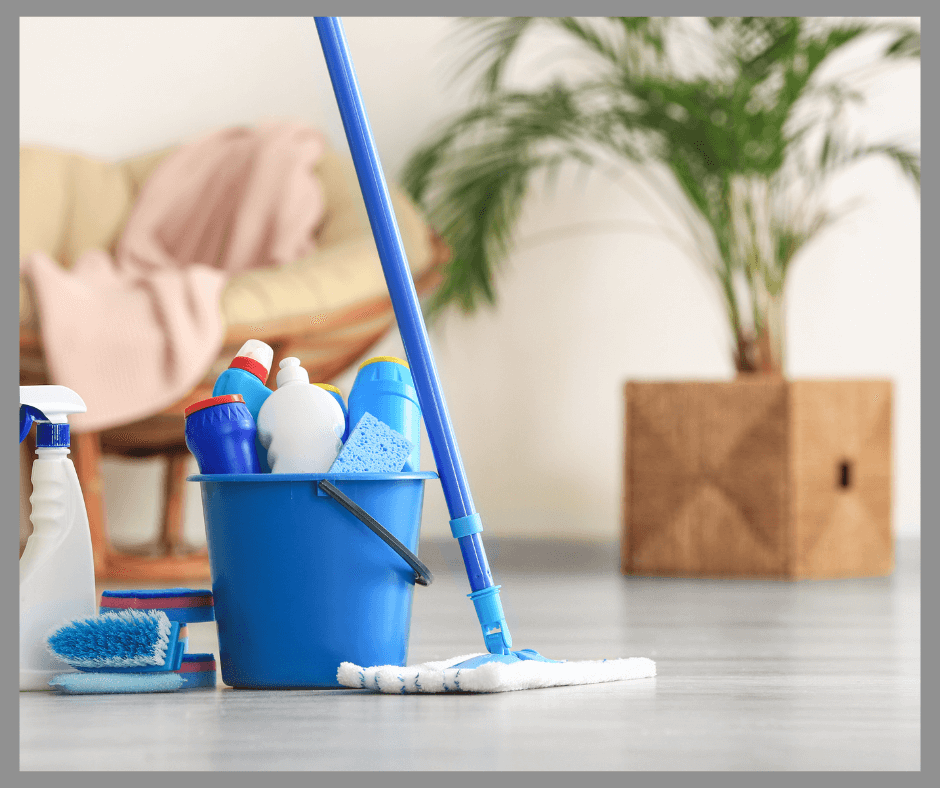 A blue bucket of cleaning supplies