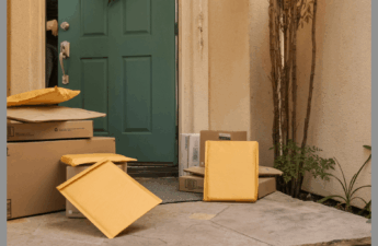 Piles of packages outside a door.