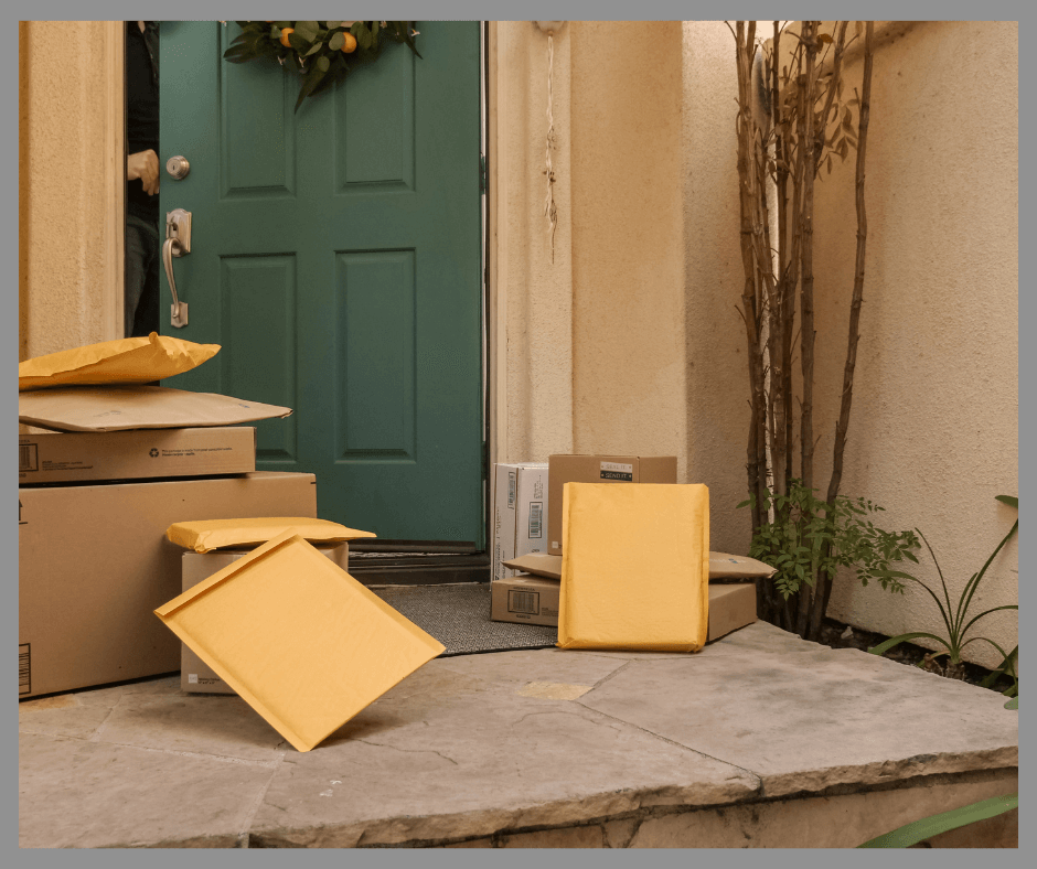 Piles of packages outside a door.