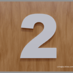 A White number two on a brown background