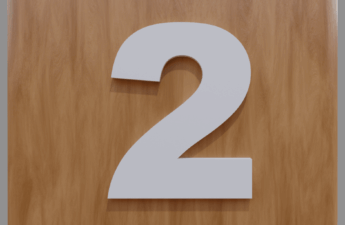 A White number two on a brown background