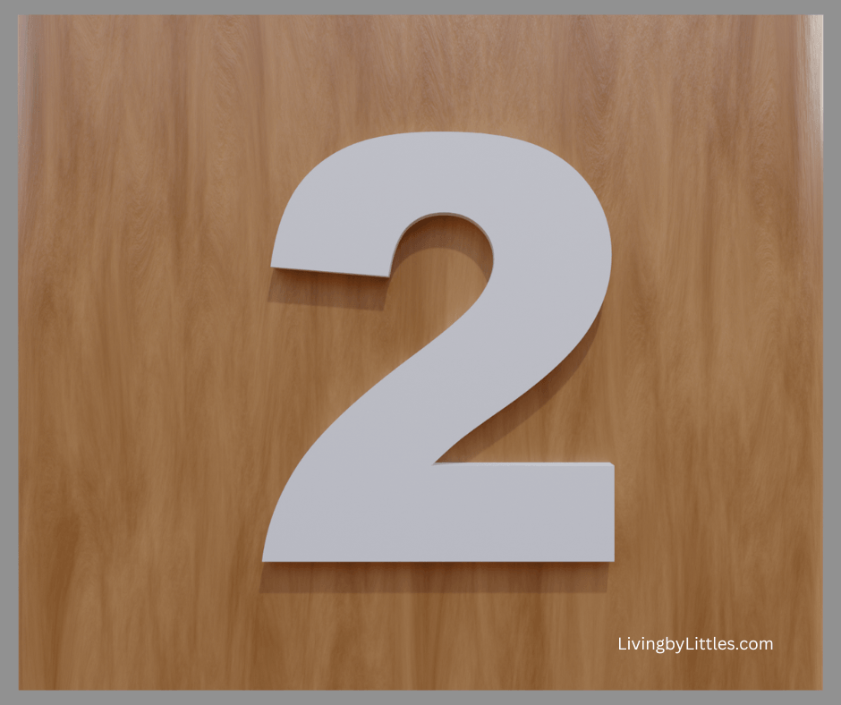 A White number two on a brown background