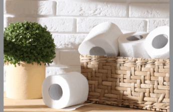 Toilet paper organized in a pretty wicker basket