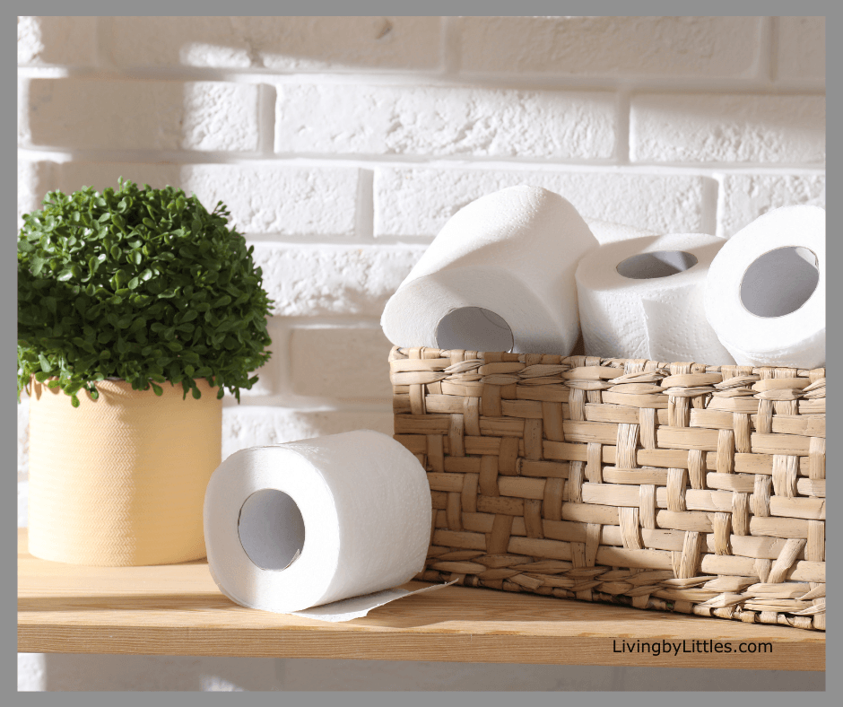 Toilet paper organized in a pretty wicker basket