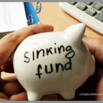 White Piggy Bank with Sinking Fund written on it.